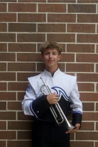 Reid Roberts with a trumpet in a band uniform